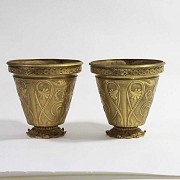 Pair of golden bronze pots.
