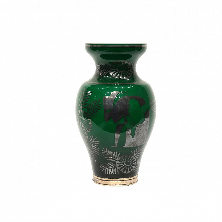 Green glass vase with silver base.