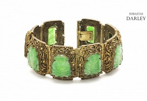 A Silver bracelet with jade plaques.