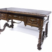 Walnut desk with carved decoration, foot with clips, early 20th century