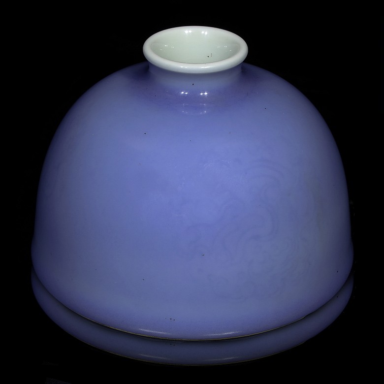 A blue-glazed water pot with 