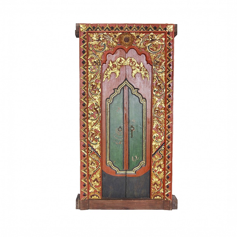 Two carved and painted wood Indonesian temple doors, early 20th century