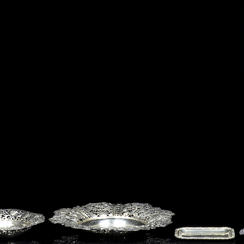 Four Spanish silver trays, 20th century