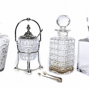 Three glass decanters and a sugar bowl.