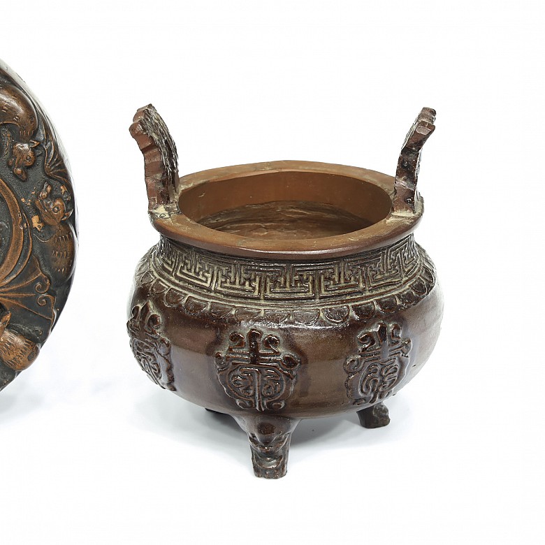 Two palettes and an earthenware censer, 20th century