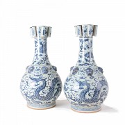 A pair of large vases, blue and white glazed pottery 