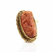 Carved coral cameo brooch, with 18k yellow gold frame.