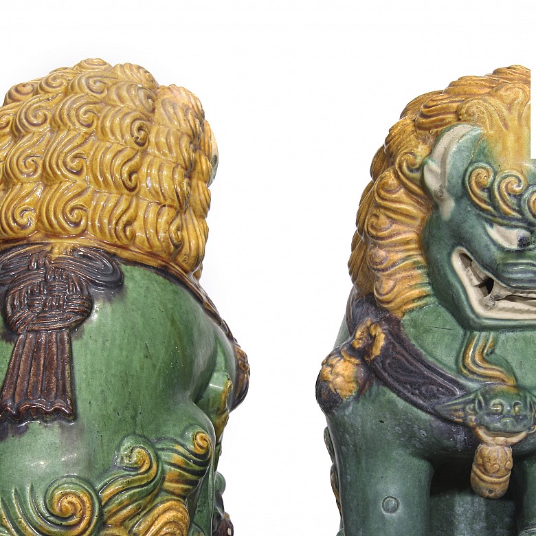 Pair of glazed ceramic lions, 20th century