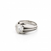 18k white gold solitaire ring with a diamond.