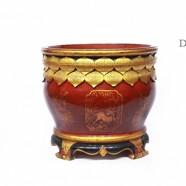 Red and gold painted wooden planter.
