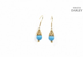 Earrings in 18k yellow gold and turquoise.