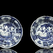 Pair of plates, blue and white, with landscapes, 20th century