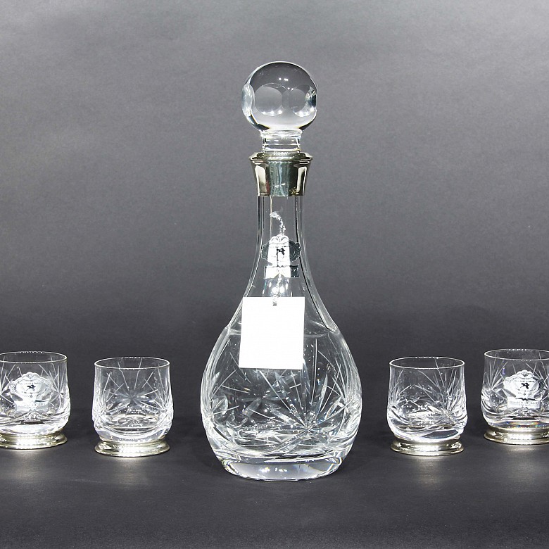 Set of decanter with six glass and silver glasses.
