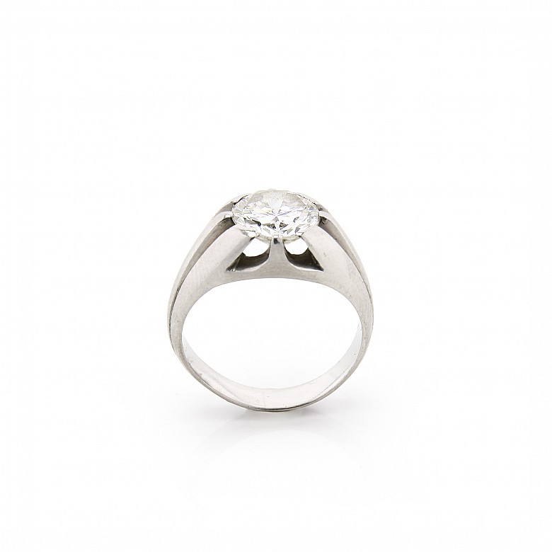 18k white gold solitaire ring with a diamond.