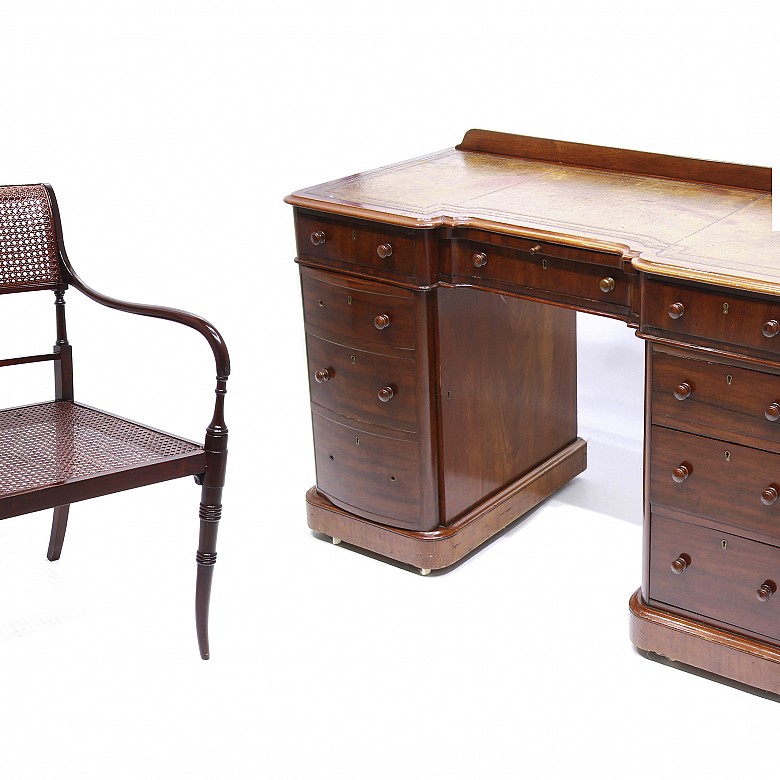 Mahogany English desk and a desk chair .
