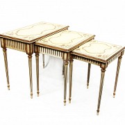 Three tables in white and gold lacquered wood, 20th century