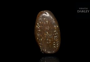 A small amulet with inscriptions, Sumerian or Assyrian.