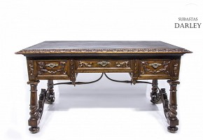 Walnut desk with carved decoration, foot with clips, early 20th century