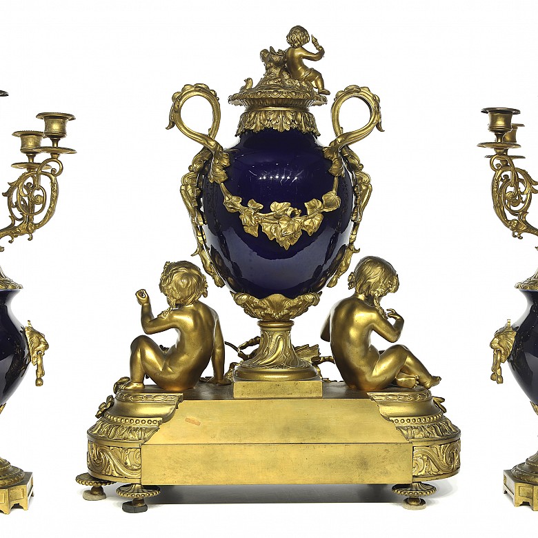 Louis XVI style table clock with five-light chandeliers, 19th century