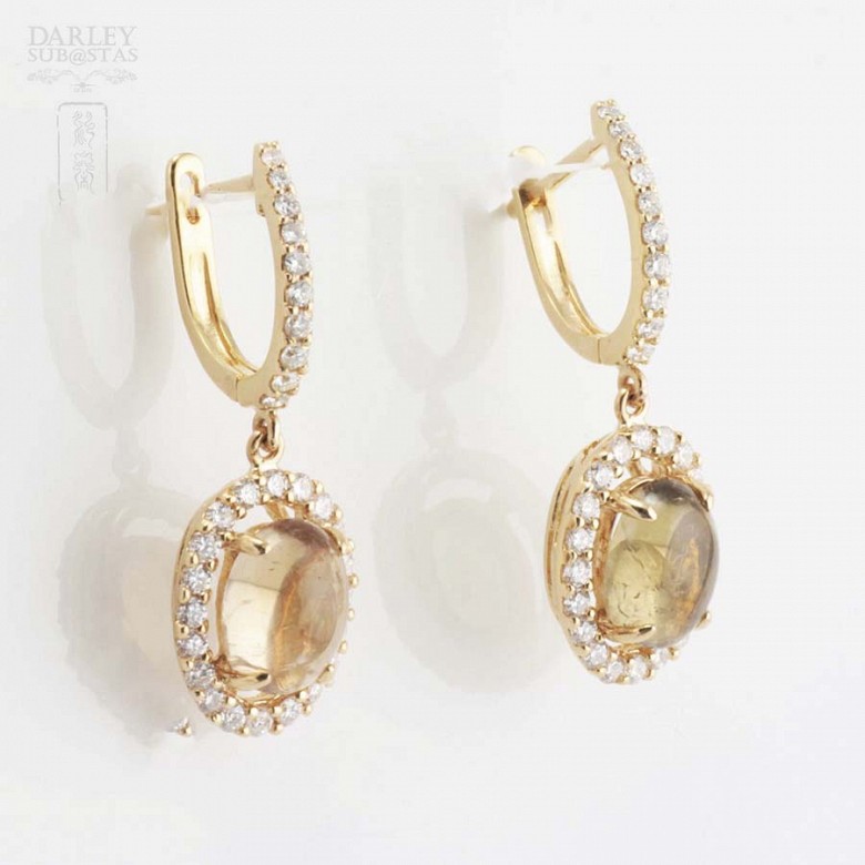 Earrings in 18k yellow gold with tourmalines and diamonds.