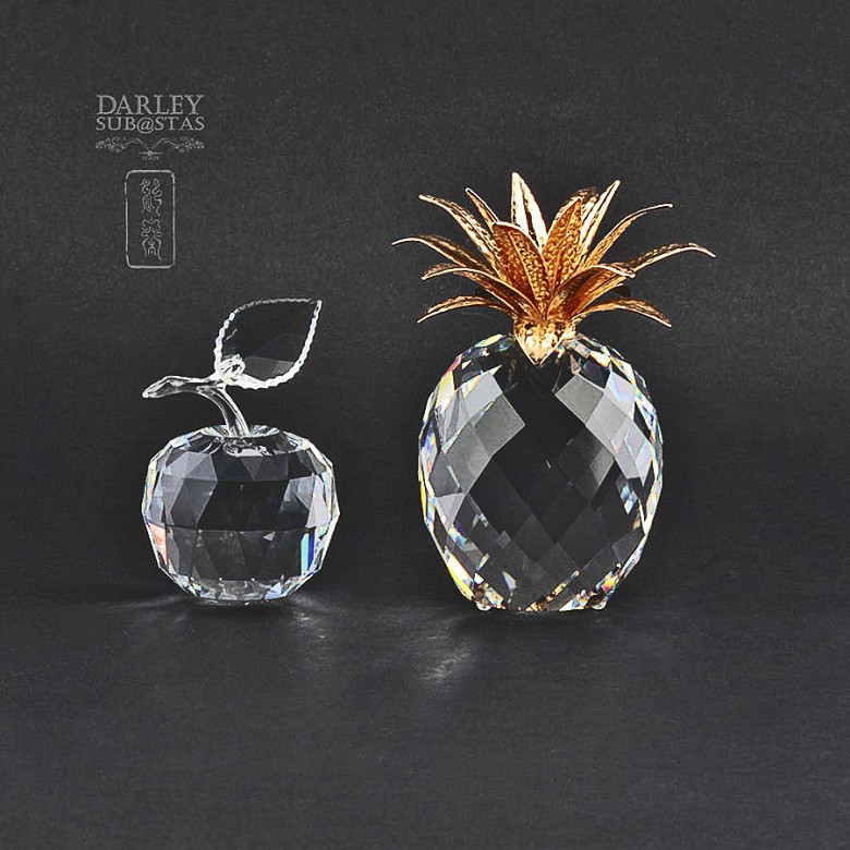 Two pieces of Swarovski crystal, apple and pineapple