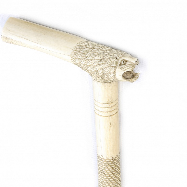 Carved walking stick with lion-headed fist, early 20th century