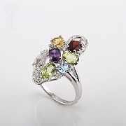 18k gold ring with five color gems and diamonds.