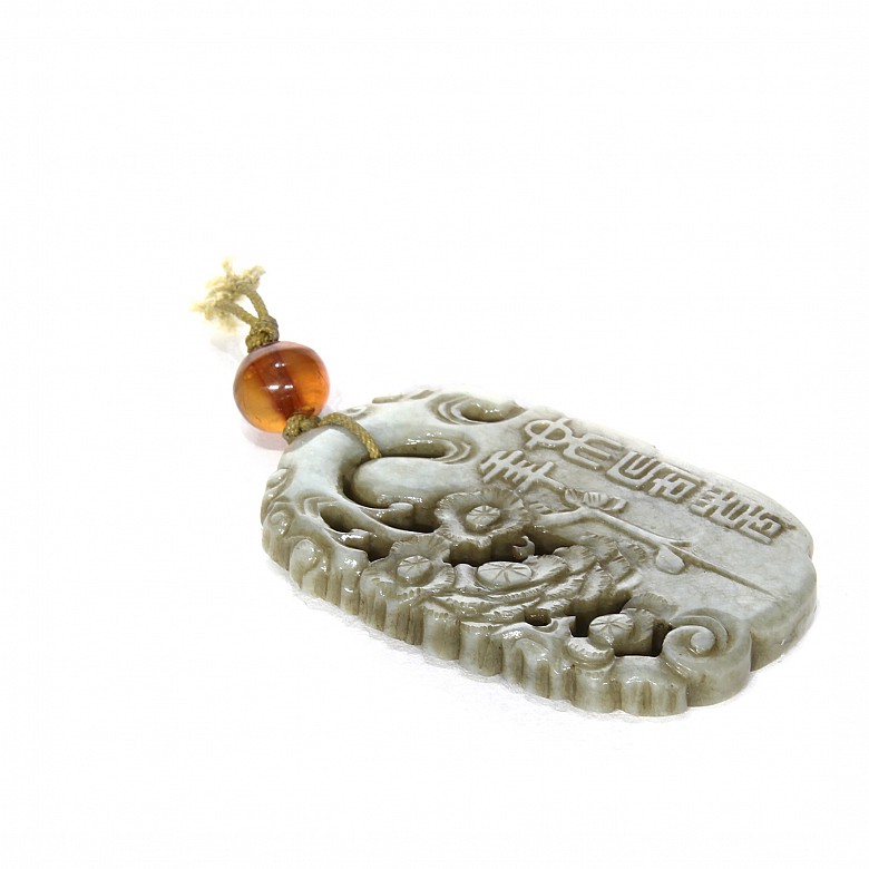 Carved jade piece and an amber bead, Qing Dynasty.