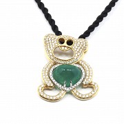 18k rose gold necklace with emerald and diamonds.