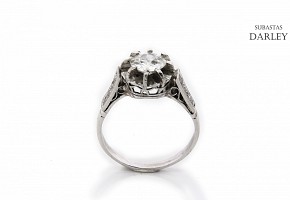 18k white gold solitaire ring with diamonds.