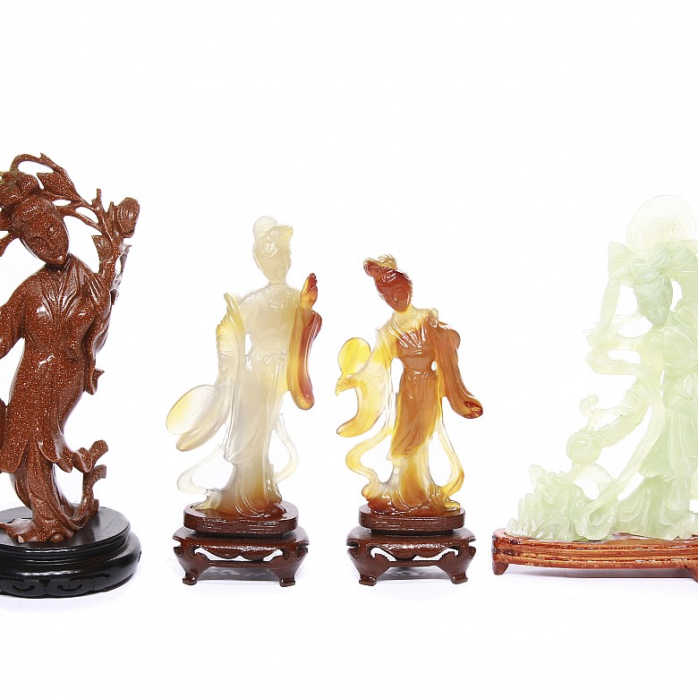 Four carved mineral figures, 