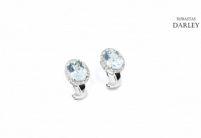 18k white gold earrings with aquamarines and diamonds.