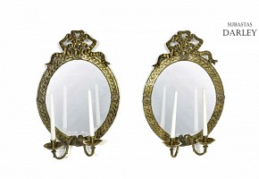 Pair of oval mirrors with bronze frame, 20th century