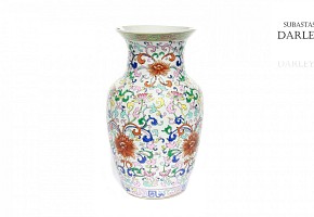 Enameled ceramic vase with flowers.