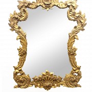 Carved and polychrome wood mirror in gilt, 20th century