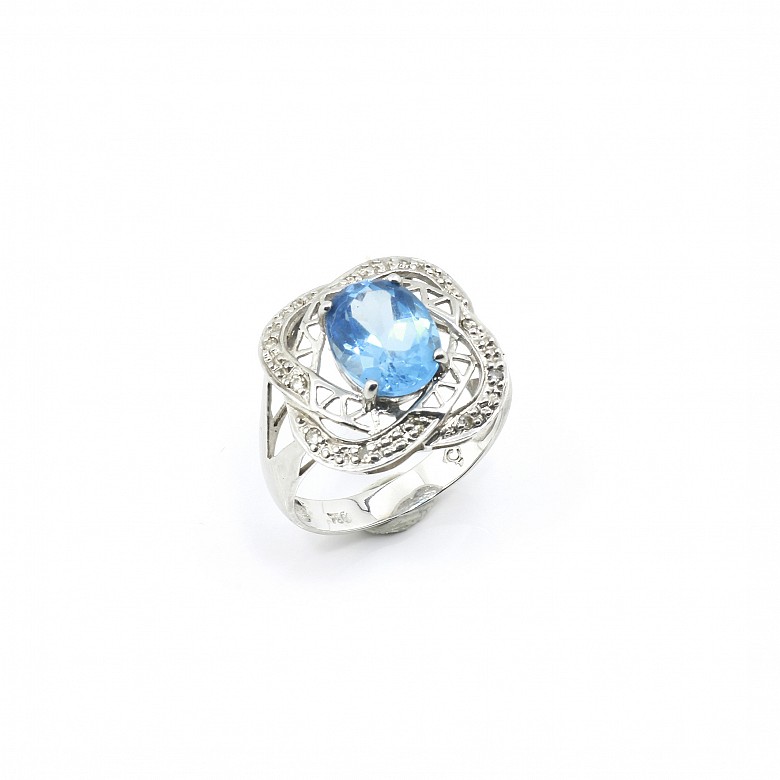 18k white gold ring with blue topaz and diamonds.