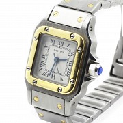 Cartier women's watch, santos model, in gold and steel.