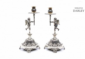 Pair of silver candlesticks in the shape of torch angels, 20th century