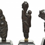 Four wooden Kris handles, Indonesia, 19th - 20th century