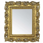 Wooden mirror with carved and gilded frame, 20th c.