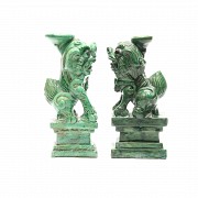A pair of porcelain green-glazed Foo Lions.