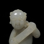 Jade figure 'Boy holding a plaque', Qing dynasty