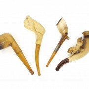 Four seafoam and amber pipes, early 20th century
