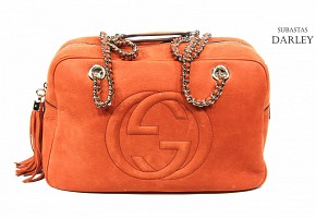 Gucci women's orange leather bag.