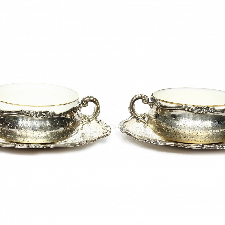 Pair of silver cups with porcelain bowl.