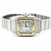 Cartier women's watch, santos model, in gold and steel.