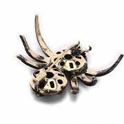 Silver brooch in the shape of a spider.