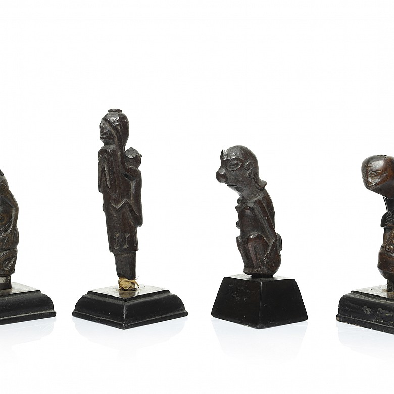 Four wooden Kris handles, Indonesia, 19th - 20th century - 1