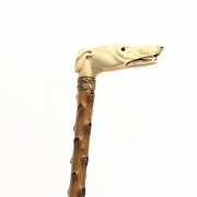 Wooden cane with ivory handle.