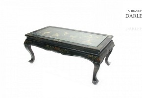 Black lacquered wooden table.